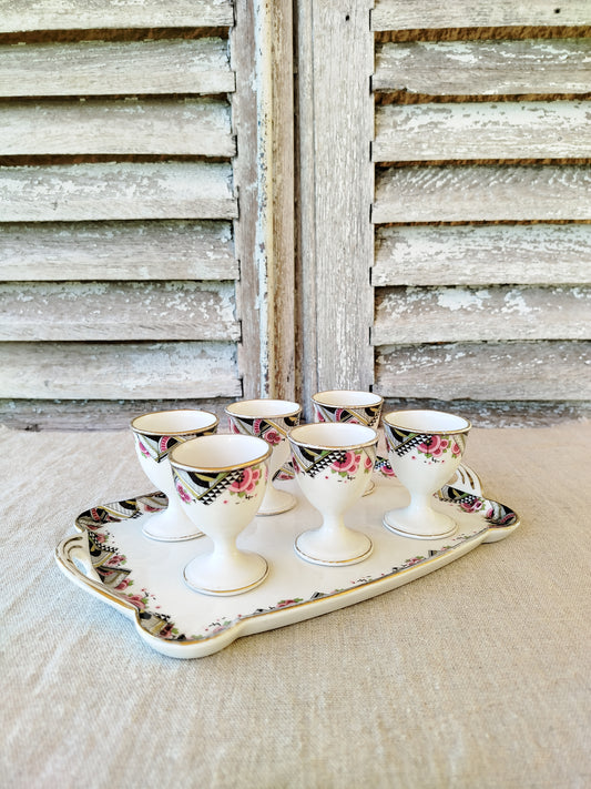 Ensemble de 6 coquetiers et plateau en porcelaine